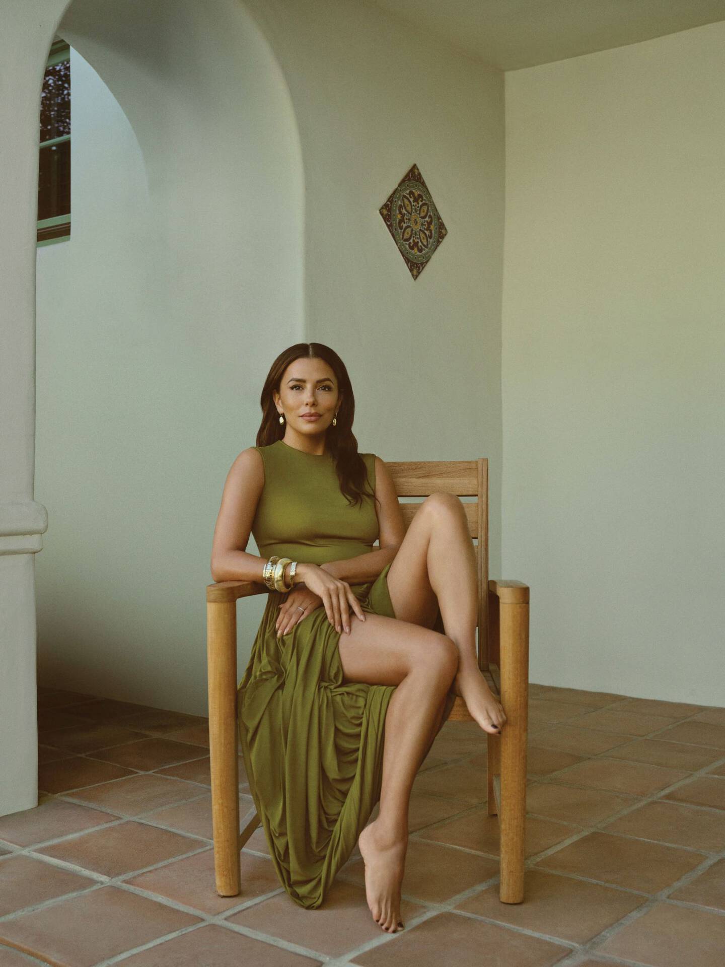 Actor Jessica Alba wearing a black-and-white Gucci jacket and pants with Ben Bridge earrings and rings